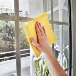 clean window with yellow cloth